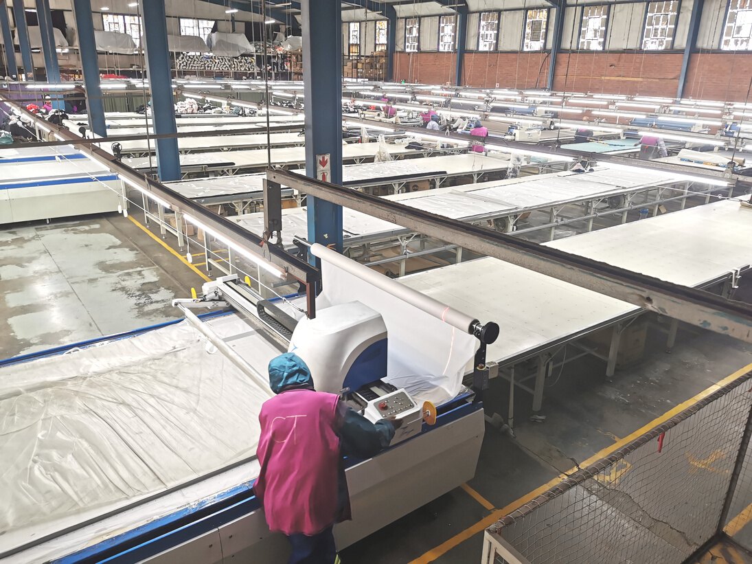 Long cutting and spreading tables inside the Hippo Knitting factory